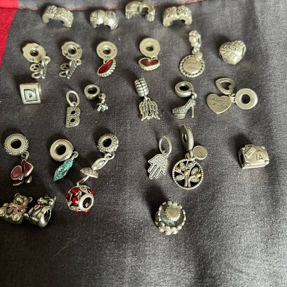 Lot of 26 Authentic Pandora charms.